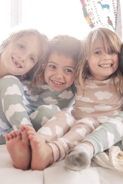 Kids wearing matching pajamas