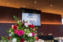 Gala Featured image 5 showing floral arrangements and screen