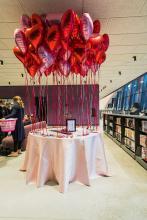 Gala Featured image 6 showing a decorated table with heart-shaped balloons