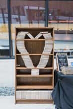 Gala Featured 3 showing a bookshelf with books placed in a heart-shape