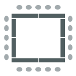 Room set up with tables arranged in large square with chairs around outside
